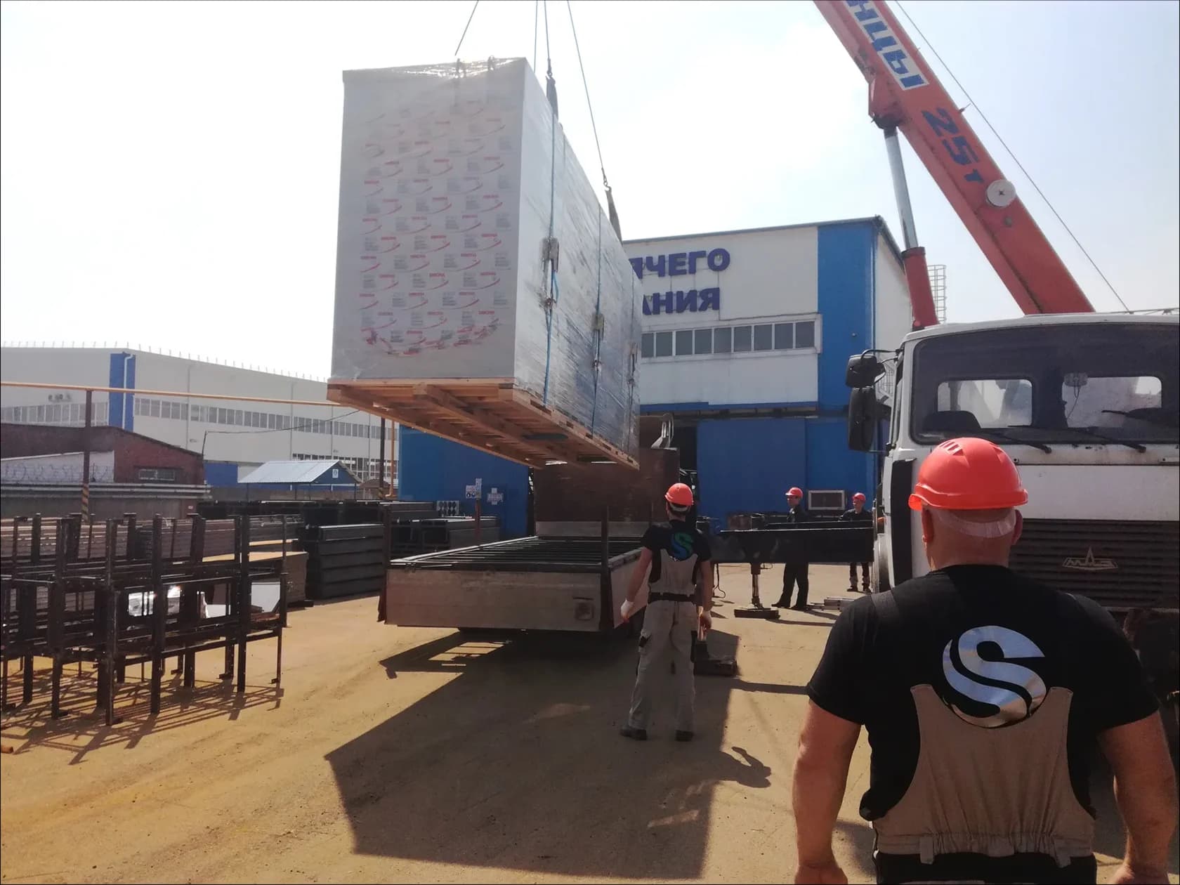 Equipment being unloaded by crane at the customer's site
